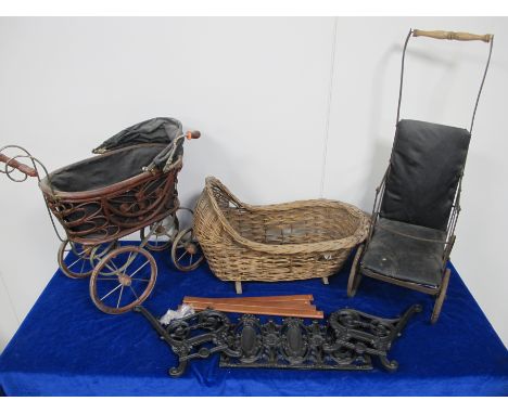 A 19th century dolls push chair,  sold together with a wicker dolls basket, dolls pram and a miniature Coalbrookdale style ca