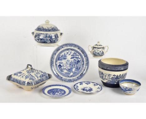 An extensive collection of blue and white British pottery,   mostly in the willow pattern, some 19th Century and some 20th Ce