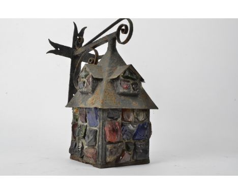 An early 20th Century cast metal lantern,  with end of day or slag type glass insets, 37cm x 26cm