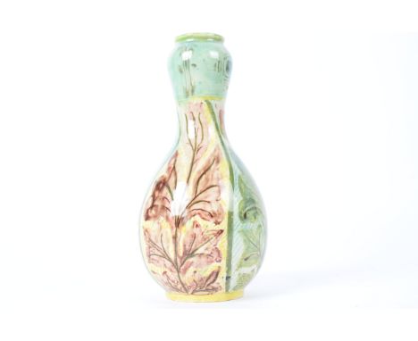 Della Robbia Pottery (Birkenhead 1894-1906), an ovoid bottle vase with alternating patterns of foliage and budding flowers, t