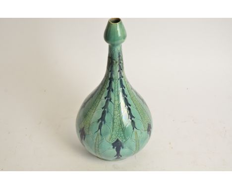 Della Robbia Pottery (Birkenhead 1894-1906),  a bulbous vase terminating in a tulip shaped neck, with stylised floral sgraffi