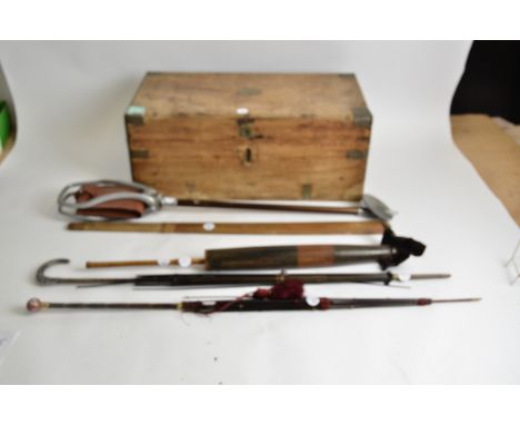 A early 20th Century small pine campaign style trunk,  together with a shooting stick and umbrellas, one topped with a silver