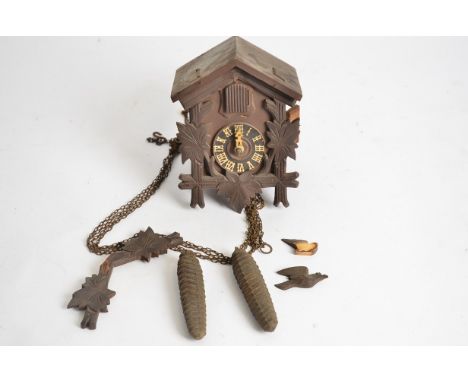 A 20th Century Continental cuckoo clock,  with weights, 18cm x 13cm