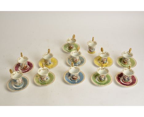 A harlequin group of Continental porcelain cups and saucers,  with gilt handles and transfer printed depictions of Juno and p