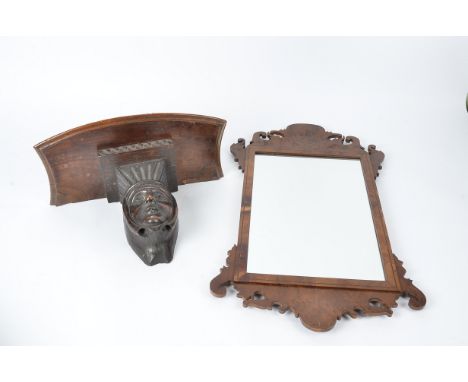 A fret carved mirror,  62cm x 36.5cm, together with a church misericord shelf, 25cm x 39cm (2) 