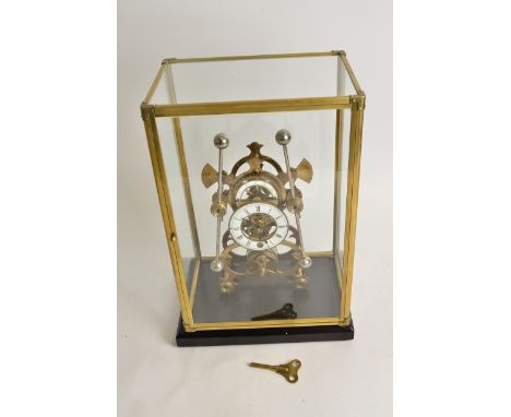 A large brass skeleton double pendulum 'Grasshopper' clock,  the central enamel dial with Roman numerals, surmounted by a hal