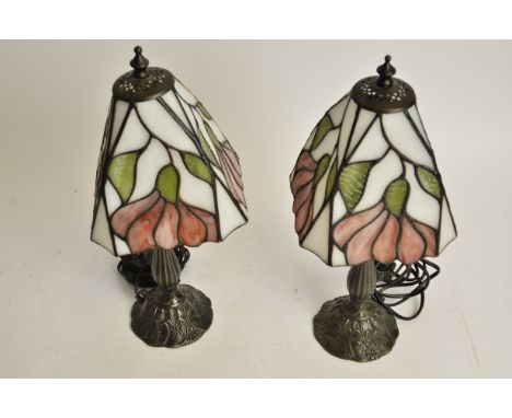A pair of contemporary Tiffany style stained glass topped table light bases, rising from organic plant life stands, height 40