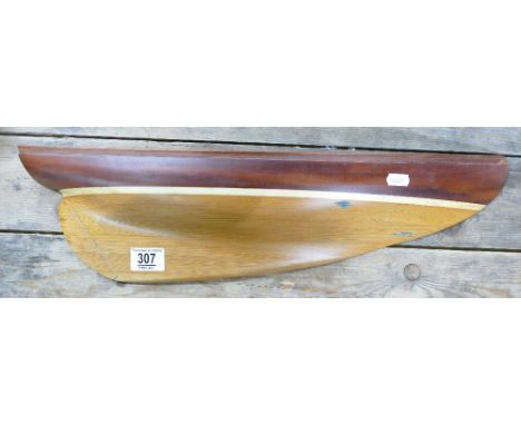 Wooden shelf in the form of a yacht : made from stay sail shhooner nina dated 1944
