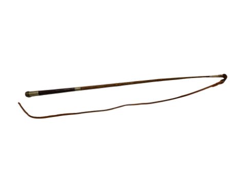 An early 20thC horse riding whip, with steel capped end inscribed Crawly Esq, maker Peterborough, 92cm long.