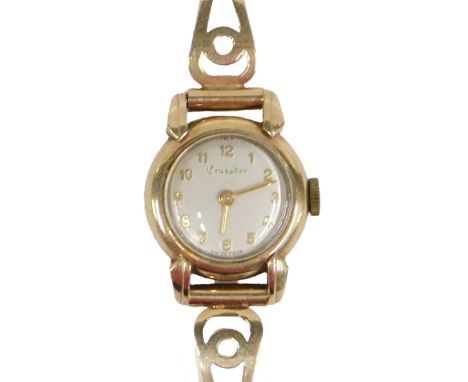 A mid 20thC Crusader lady's 9ct gold wristwatch, with a silvered dial, and three bar bracelet, London 1952, 15.30g all in.