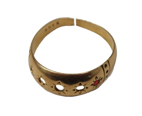An 18ct gold dress ring, set with five tiny garnets, and one single stone, the rest missing, cut, 2g.