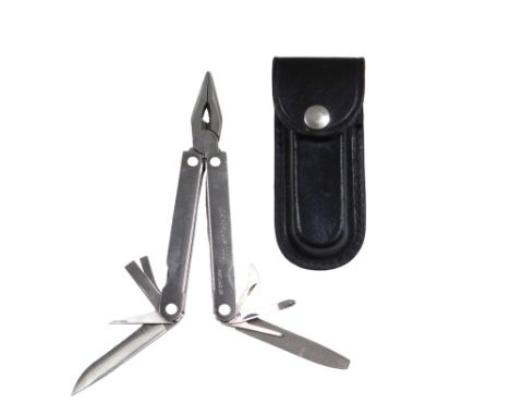 A Leatherman tool pocket knife, in leather scabbard.