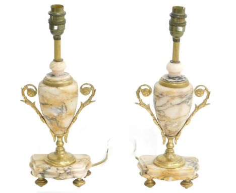 A pair of late 19th/early 20thC clock garniture urns, each with gilt metal handles, converted to table lamps, 44cm high.