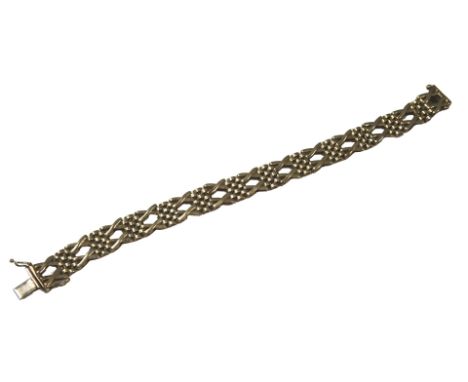 A 9ct gold bracelet, of two cross and dot design, 19cm long, 17.4g, boxed.