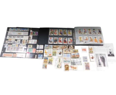 An album of cigarette cards, various loose player's cigarette cards, stamp sheets, etc. (a quantity)