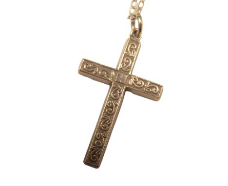 A 9ct gold crucifix pendant and chain, the embossed crucifix 3cm high, on a fine link neck chain, 44cm long, 4.6g.