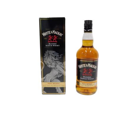 A bottle of Whyte and Mackay Blended Scotch whisky triple matured, boxed.