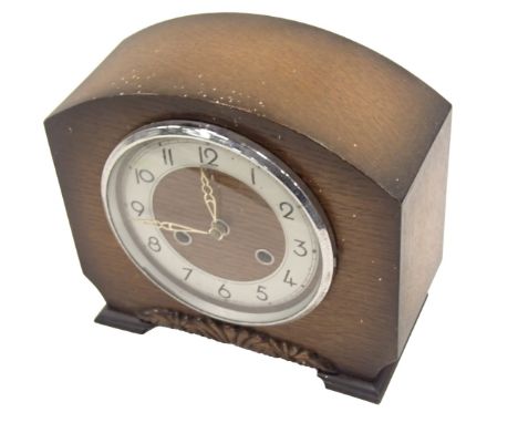 A 1950s Bentima oak cased mantel clock, the arch top with floral scroll dial, silvered numeric chapter ring, 22cm high, 23cm 