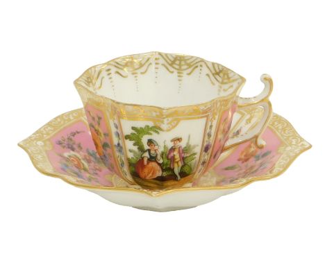 A Continental porcelain cup and saucer, on a pink ground, decorated with floral sprays and figures, with blue R stamp to unde