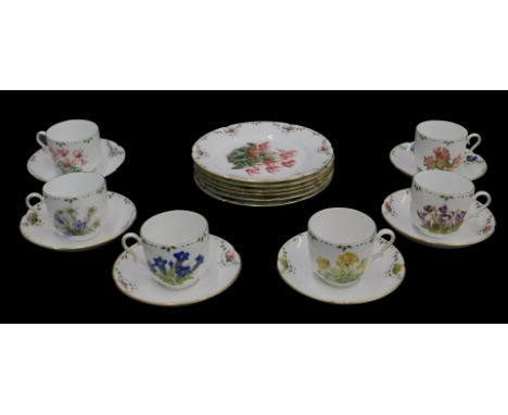 A Continental porcelain part tea service, printed with botanical specimens, to include six cups and saucers, and side plates.