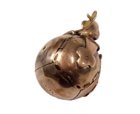 A 9ct gold Masonic ball pendant, the ball with fleur de lys clasp opening to reveal hieroglyphics, yellow metal unmarked, 7.9