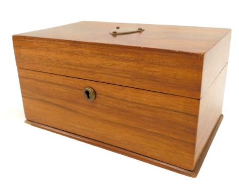 A 19thC mahogany tea caddy, with brass shield, opening to reveal a partially lined interior, 10cm high, 20cm wide, 13cm deep.