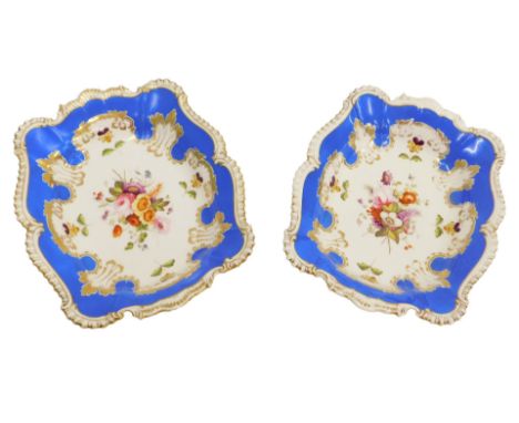 A pair of Chamberlain's Worcester porcelain dessert dishes, with gilt gadrooned rococo border, the central reserve of flowers