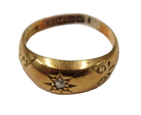 An 18ct gold diamond set dress ring, the round brilliant cut diamond in illusion star setting, with scroll design shoulders, 