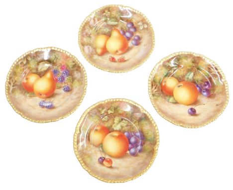 A set of four Royal Worcester porcelain plates, depicting fruit, signed Freeman, 15cm diameter.