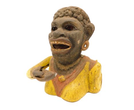 A cast iron money box, painted in black, orange and yellow, modelled in the form of a female figure with crooked arm, titled 