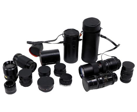 A group of camera lenses, comprising a Pentagon 4/200, Access SQ number 89532 lens, a Photax Paragon 583318, Olympus 50mm cam