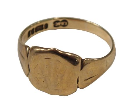 A 9ct gold signet ring, the shield with rubbed initials, on rubbed shoulders, ring size U½, 4.5g.