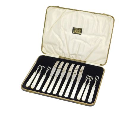 A set of silver plated and mother of pearl handled dessert knives and forks, retailed by G Hewitt and Son Grimsby.