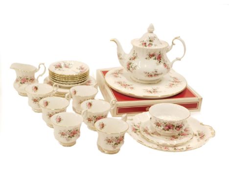 A Royal Albert Lavender Rose pattern part tea service, comprising cake plates, teapot, milk jug, sugar bowl, six cups and sau