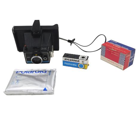 Camera and optics equipment, comprising a Polaroid Colour Pack 2, a Sun Pack DC3, a Corvette box camera, and an Ilford Sports