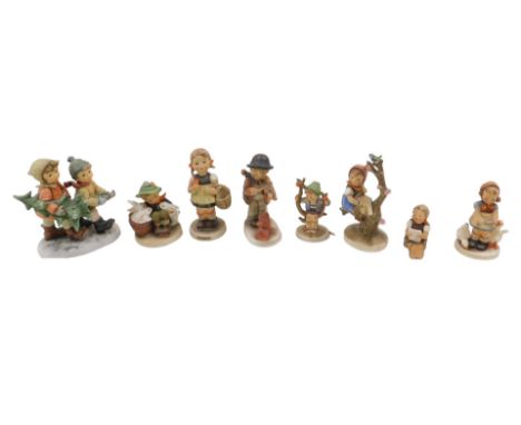 A collection of Hummel figurines, to include Tree Trimming Time, boy with violin, etc. (1 tray)