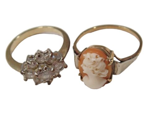 Two dress rings, comprising a cameo dress ring, with V splayed white metal shoulders, on a yellow metal band stamped 9ct, rin