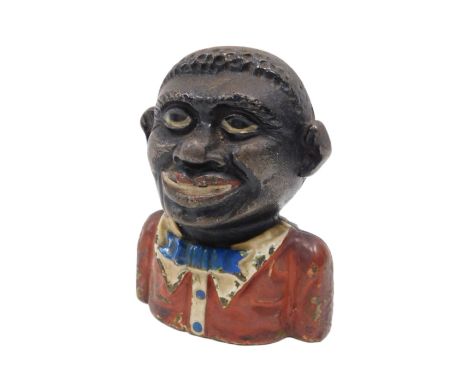 A cast money box modelled as a young man, painted in red and black. Notice from the the-saleroom.com: These items are listed 