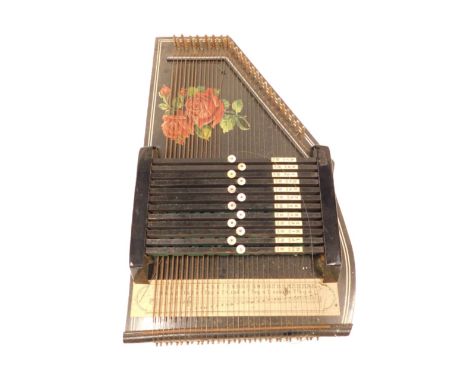 An ebonised zither, in outer case, boxed, 52cm long. (AF)