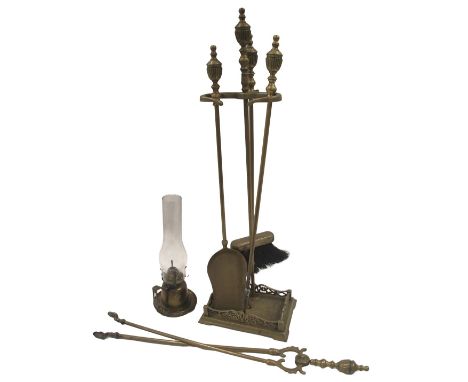 A 20thC brass fire side set, comprising brush, poker, tongs, and shovel, in a fitted basket, 78cm high, and a wall mounted oi