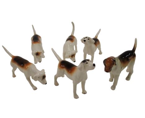 A collection of five Beswick hunting hounds, and another similar.