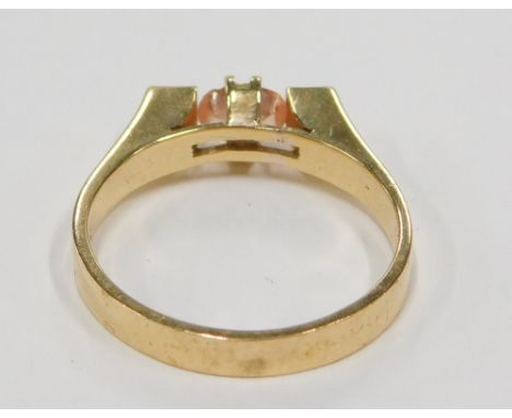 A sapphire and diamond 20thC dress ring, set with oval cut orange/pink sapphire, 5.5mm x 4.1mm x 2.5mm, approx 0.47ct, claw s