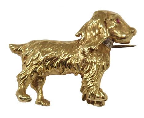An 18ct gold Spaniel, of textured form, with ruby eye and diamond set collar, stamped BR Limited, London possibly 1908, 3cm w