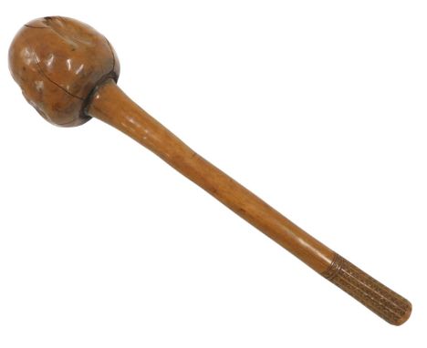 A 19thC Fijian knobkerrie or club, with a shaped and carved handle, 37cm high.