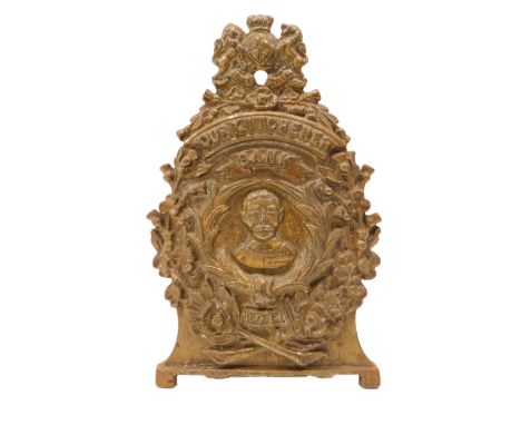 A gilt coloured cast iron money box, decorated with the Lord Kitchener in profile below a crest and within a recess stamped R