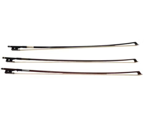 Three various violin bows, comprising a TSP UK, black ebonised example, each with ebony and mother of pearl inlaid turn peg, 
