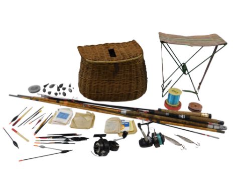 A wicker fishing creel and other fishing tackle and rods, the creel with leather strap, and two spinning rods, and a bamboo t