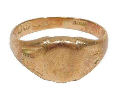 A 15ct gold signet ring, the oval panel of plain design, ring size M½, with rubbed marks possibly Birmingham, 4.5g all in.