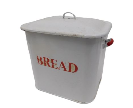 A white enamel bread bin with lid, with red lettering, and side handles, 29cm high.