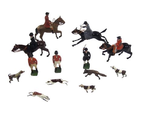 A small group of play worn diecast Britain's figures, hunting on horseback and dogs.
